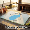 Glass cutting board featuring a map of Lake Pulaski, Minnesota, on a wooden outdoor bar.