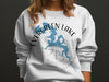 White sweatshirt with blue map of Evergreen Lake and compass graphic.
