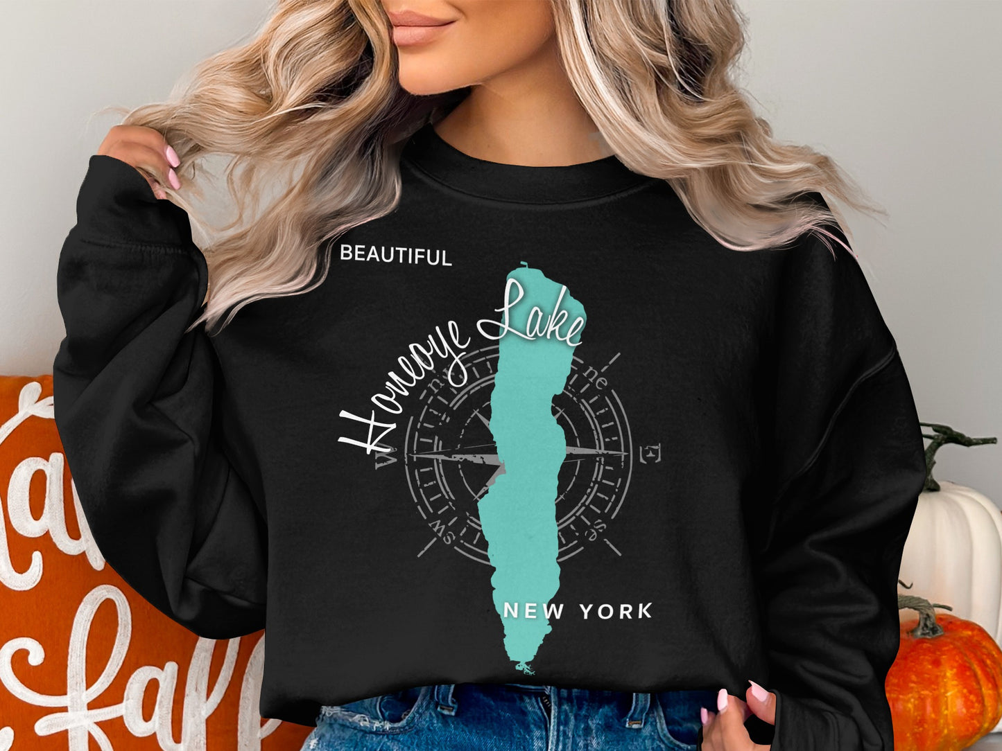 Black sweatshirt with teal "Honeoye Lake" map graphic and compass rose.