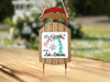 Sled ornament with "Merry Christmas From Lake Lotawana" text and snowflakes.