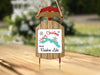 Sled ornament with "Merry Christmas from Rainbow Lake" text and lake graphic.