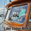Teal Las Vegas Life sticker on a boat window, "Lake Lodge Media" text below.