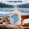White mug with Lake Istokpoga map design, steaming hot, by a window.