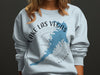 Light blue sweatshirt with Lake Las Vegas map and compass design.