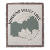 Woven throw with Diamond Valley Lake map and California text.