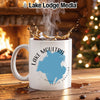 White mug with Lake Moultrie, South Carolina design, steaming coffee, fireplace and Christmas tree background.