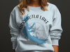 Light blue sweatshirt with Arkabutla Lake Mississippi map and compass design.