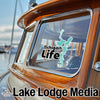 Teal Tichigan Life sticker on boat window with Lake Lodge Media logo.