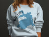 Light blue sweatshirt with "Big Lake Arizona" text and lake shape graphic.