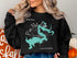 Black sweatshirt featuring a teal map of Pine Flat Lake with compass rose and text.
