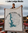 Man holding blanket with Eagle Mountain Lake map, compass, and Texas text.