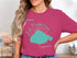Woman wearing pink t-shirt with Lake Pontchartrain Louisiana map graphic.