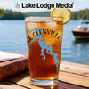 Glass with Lake Glenville map and compass design, garnished with lemon slice.