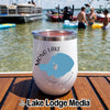 A white insulated wine tumbler with Mono Lake California map graphic rests on a wooden boat deck.