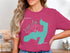 Pink t-shirt with teal outline of Long Island, New York and compass rose graphic.