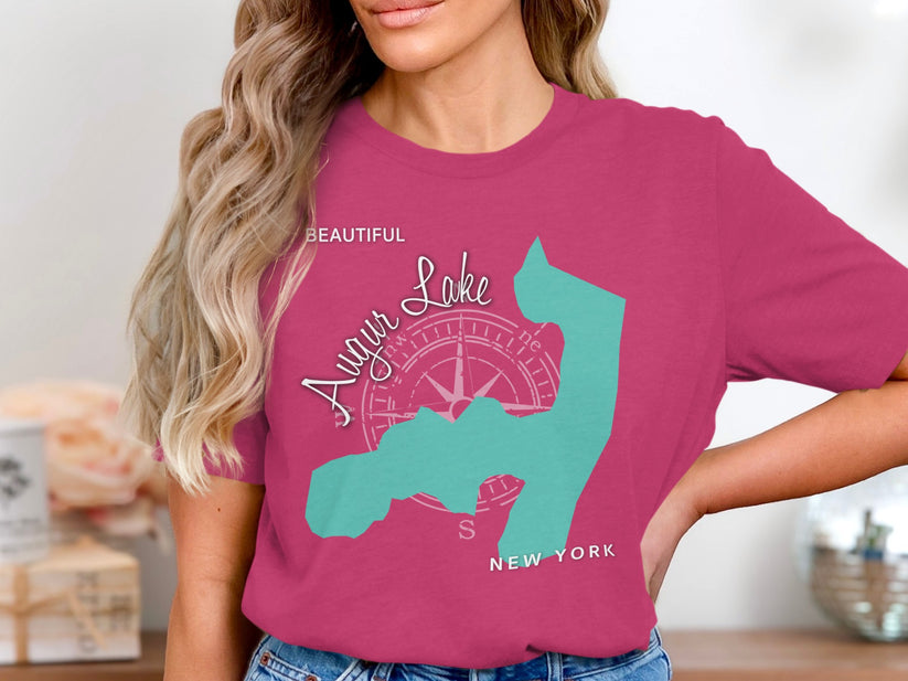 Pink t-shirt with teal outline of Long Island, New York and compass rose graphic.
