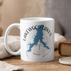 White mug with blue Lakewood Lakes map and compass design, "Lakewood Lakes Missouri" text.