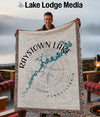 Man holding Raystown Lake Pennsylvania map blanket with compass rose.