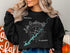 Black sweatshirt with Lake Guntersville map and compass design.