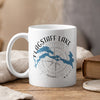 White mug with "Flagstaff Lake Maine" text, lake outline, and compass design.