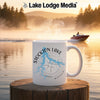 White mug with Stockton Lake map and compass design on a lakeside background.