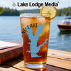 Glass of iced tea with lemon, featuring a blue lake map graphic and "Lake Lodge Media" logo.