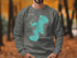 Grey sweatshirt with teal map outline of Canobie Lake, New Hampshire.