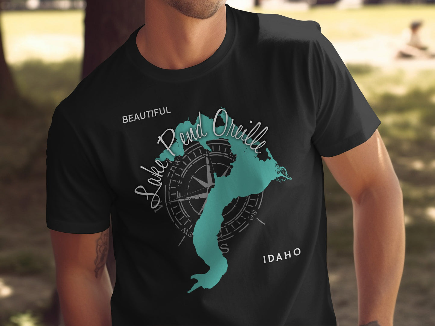 Black t-shirt with "Lake Pend Oreille IDAHO" map graphic and compass.