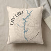 Cream pillow with Lay Lake Alabama map and compass design.