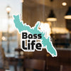 Turquoise map outline sticker with "Bass Life" text in black on a window.