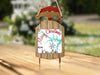 Wooden sled ornament with "Merry Christmas from Kerr Lake" text and snowflake.