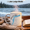 White mug with Baker Lake, Washington map and compass design, steam rising.