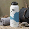 White water bottle with a map of a lake, compass, and text.