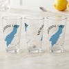 Clear glasses with blue Moraine Lake outline and compass design.