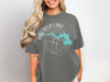 Grey t-shirt with Pactola Lake, South Dakota compass graphic.