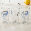 Three clear glasses feature "Beaver Lake" and a blue lake map with compass.