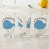 Three glasses with blue Lake Pontchartrain maps and compass graphics.