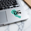 Turquoise pyramid graphic sticker with black "Pyramid Life" text on a laptop.