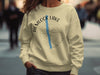 Light yellow crewneck sweatshirt with Hemlock Lake New York compass design.