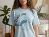 Light blue t-shirt with "Cedar Lake Ontario" and a blue lake outline on a compass.