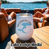 A white stemless wine tumbler on a wooden boat table, featuring a Silverwood Lake California design.