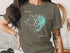 Green t-shirt with a compass rose and "Charleston Ontario" map design.