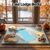 Custom glass cutting board printed with a map of Cain Lake, Washington, displayed on a wooden table.