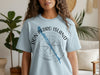 Light blue t-shirt with a compass graphic and "Don Pedro Island Florida" text.