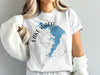 White t-shirt with blue Lake Waco map graphic and compass design.