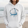 White hoodie with blue Lake Thunderbird Oklahoma map and compass graphic.