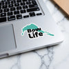 Teal outline sticker with black text "Bow Life" on a laptop.