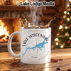 White mug with "Lake Wisconsin" text and map graphic, steaming coffee splashing.