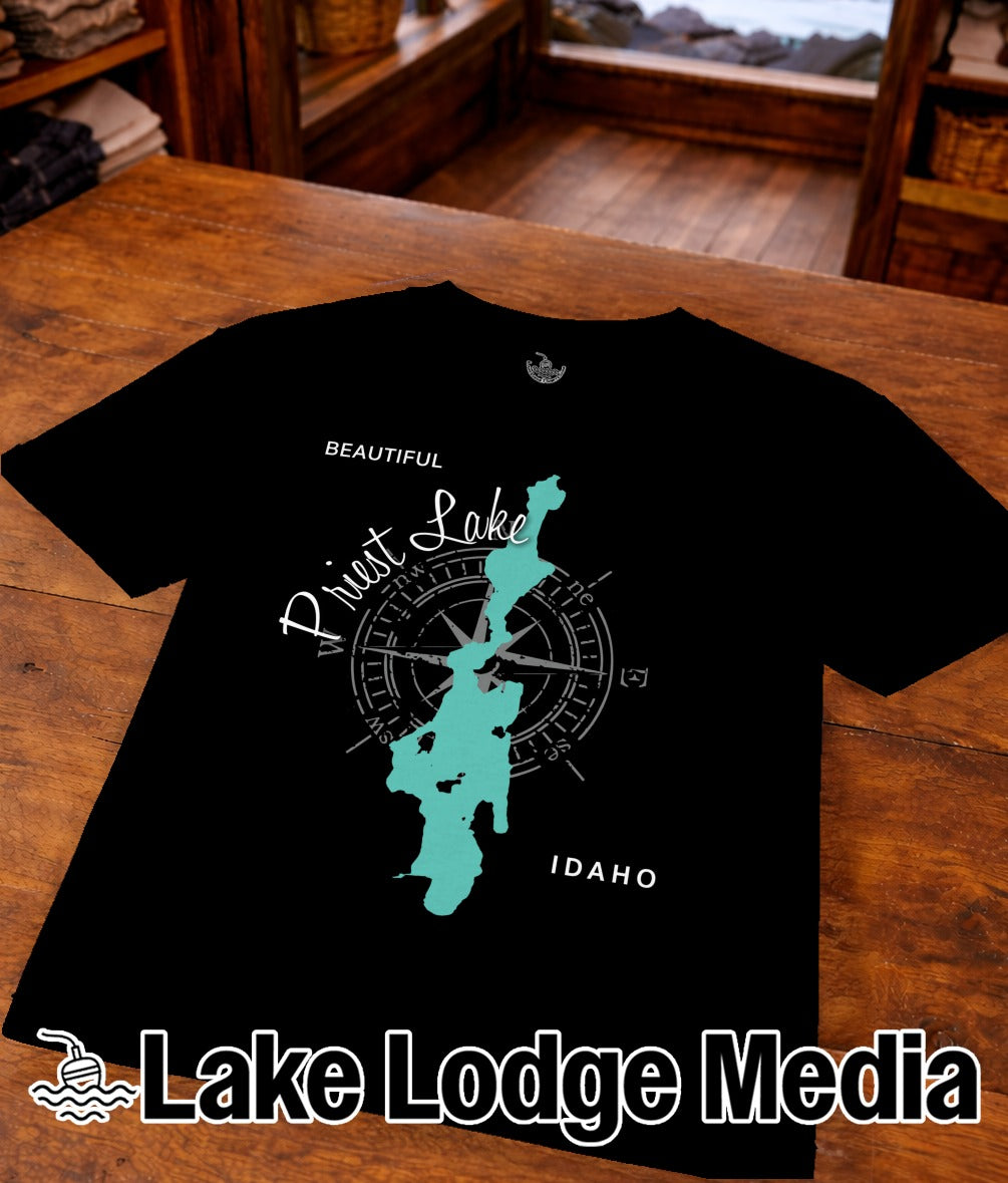 Black t-shirt with teal outline map of Priest Lake, Idaho, and compass rose.