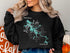 Black sweatshirt with "Natty Lake Georgia" and a compass rose design.